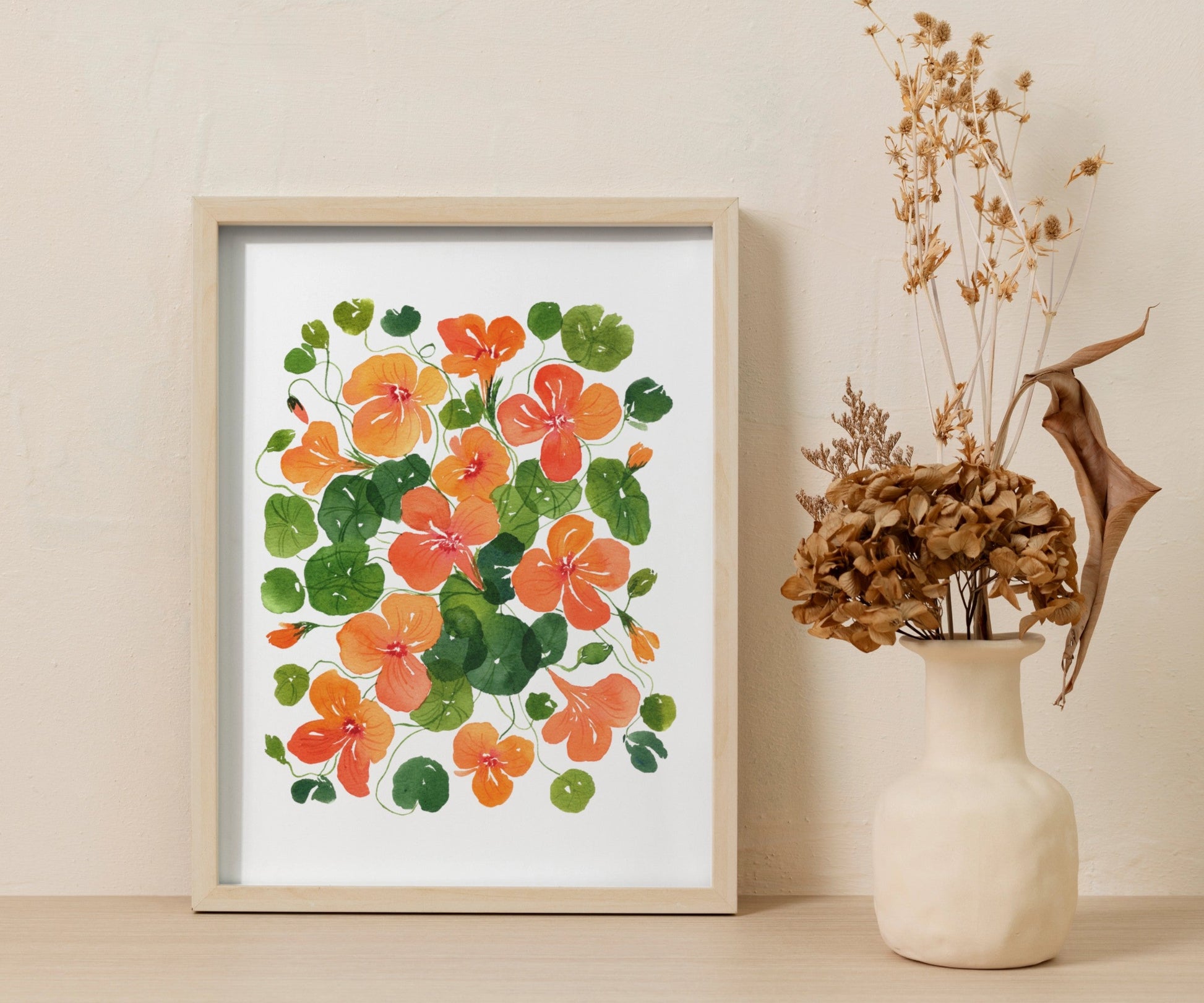 A delicate watercolour floral art print featuring hand-painted Nasturtium flowers in warm tones, ideal for home decor and gifting, designed in New Zealand.